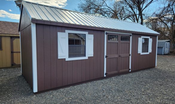 Stock# 9-23  10 x 26 A-frame painted dark brown,  W/ larger windows 2) lofts & work bench $9484.00