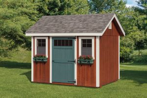 Garden Shed with red wood siding, white trim, a teal door with windows, 2 windows with flower boxes, and brown asphalt roofing.