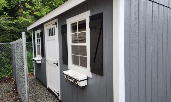 Stock#2023 GRG 10X16 cape, extra door,  transom in door, golded garden pkg, loft $6462.00