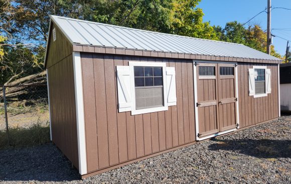 Stock# 9-23 10x26 painted wood, metal roof, larger window 7' wall 2) lofts , work bench $9484.00, discounted to $9010.00