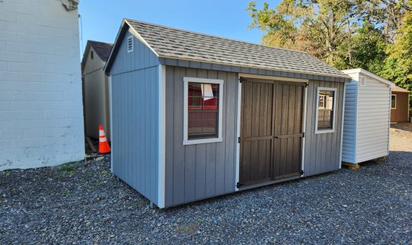 Stock#42-24 8×16 wood 7' Cape, 2 painted doors Ebony, 2 larger windows  2 4x8 lofts $5031.00