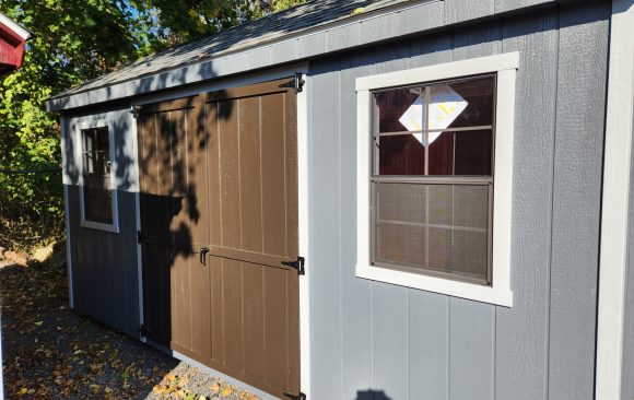 Stock#50-24 8×16 7' Cape Ebony doors,  2) 4x8 lofts,  wood corners,  2 larger windows,  5036.00