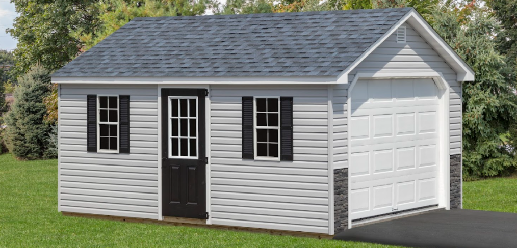 A-frame garage shed with gray siding, black doors and windows, and white garage door