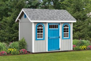 garden shed with gray siding, bright blue windows and door, and grey roof with white trim