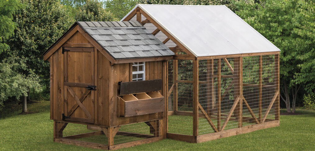 brown chicken coop with hen house and run