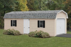 dutch barn garage with tan siding